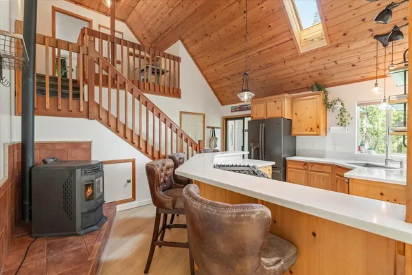 a dining room with furniture window and wooden floor
