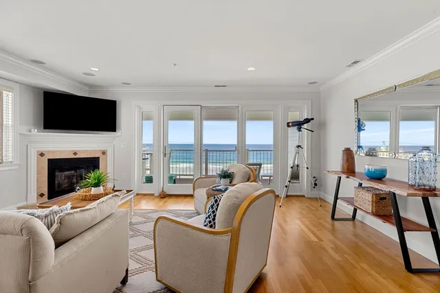 a living room with fireplace furniture and a flat screen tv