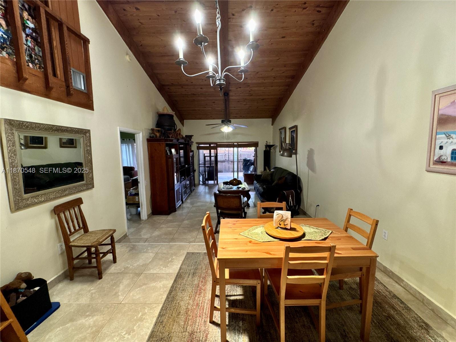 13527 Southwest 101st Lane Miami, FL 33186 - Photo 12 of 45 a view of a dining room with furniture and a livingroom