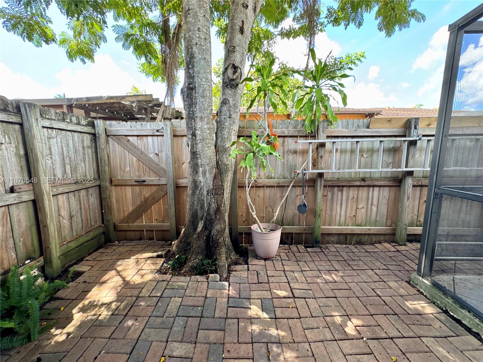 13527 Southwest 101st Lane Miami, FL 33186 - Photo 29 of 45 a view of a pathway with a backyard