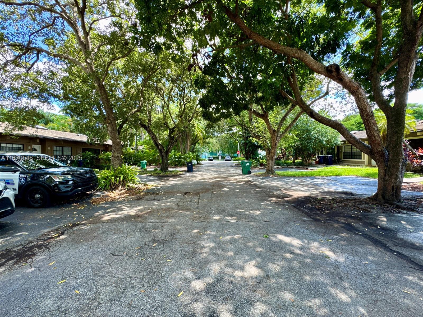13527 Southwest 101st Lane Miami, FL 33186 - Photo 32 of 45 a view of street with parked cars