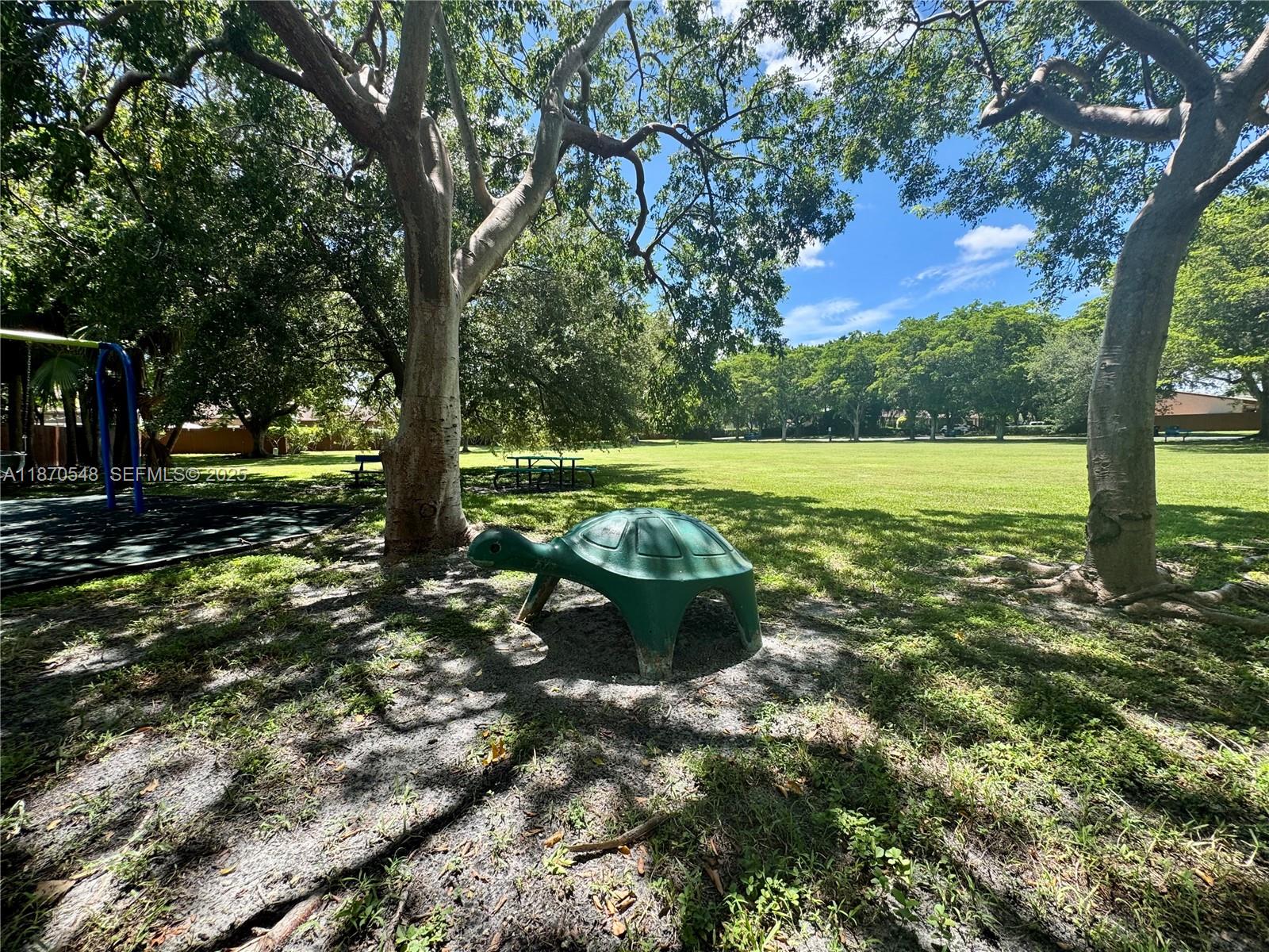 13527 Southwest 101st Lane Miami, FL 33186 - Photo 42 of 45 a view of a backyard with large trees