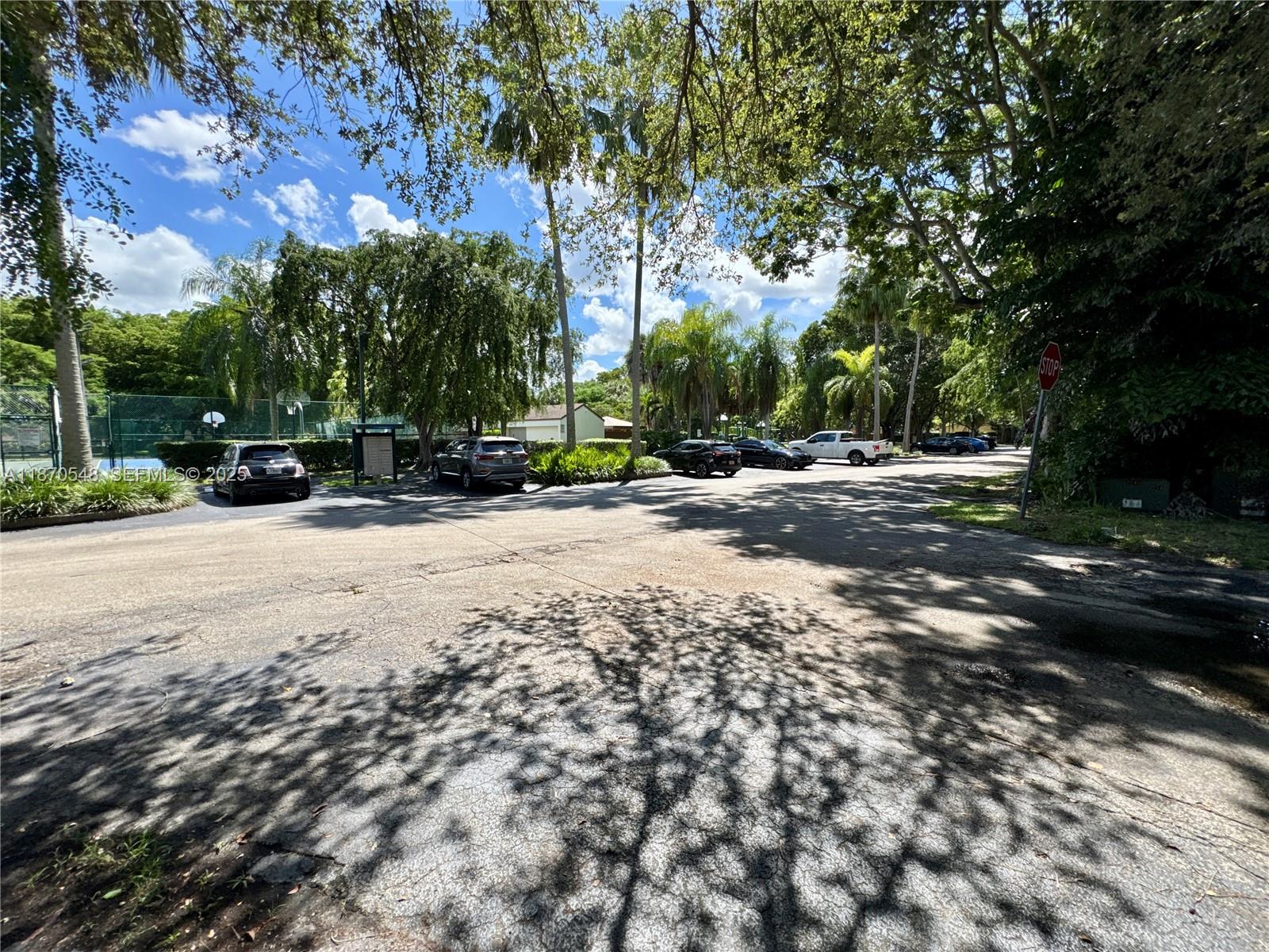 13527 Southwest 101st Lane Miami, FL 33186 - Photo 44 of 45 a view of road with trees