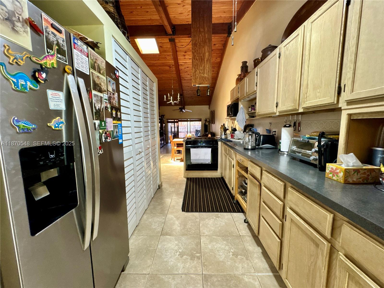 13527 Southwest 101st Lane Miami, FL 33186 - Photo 7 of 45 a kitchen with stainless steel appliances granite countertop a refrigerator and a sink