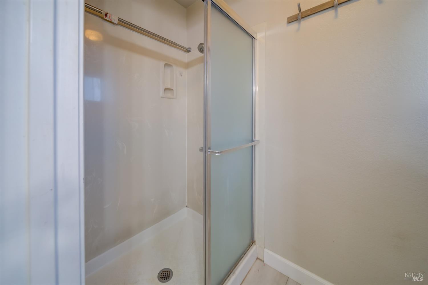 989 Suffolk Way Fairfield, CA 94533 - Photo 26 of 30 a bathroom with a glass shower door