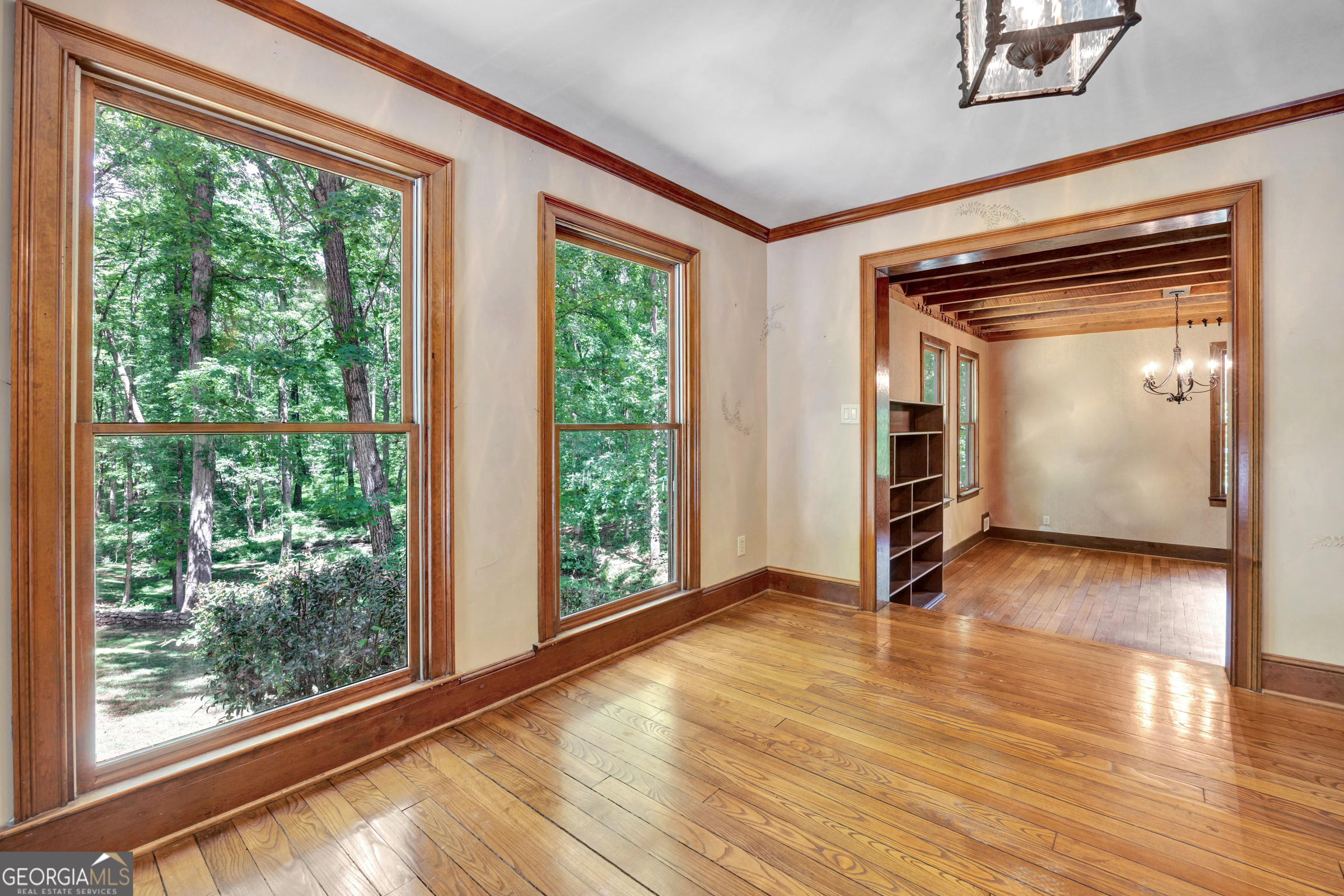 400 River Cove Road Social Circle, GA 30025 - Photo 11 of 83 a view of empty room with wooden floor and fan