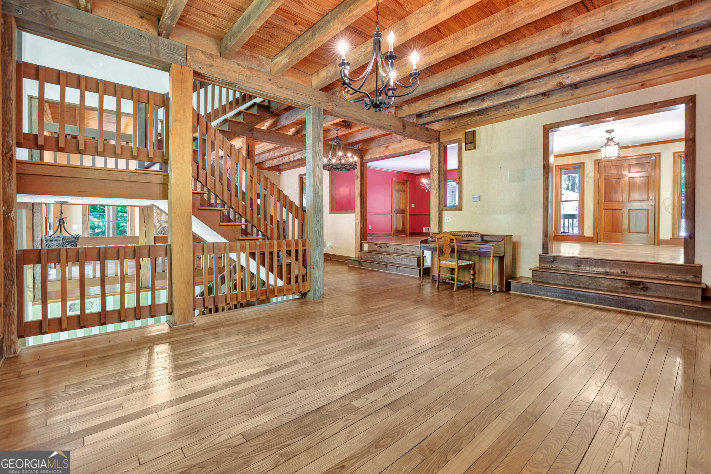 400 River Cove Road Social Circle, GA 30025 - Photo 13 of 83 a view of a room with wooden floor and furniture