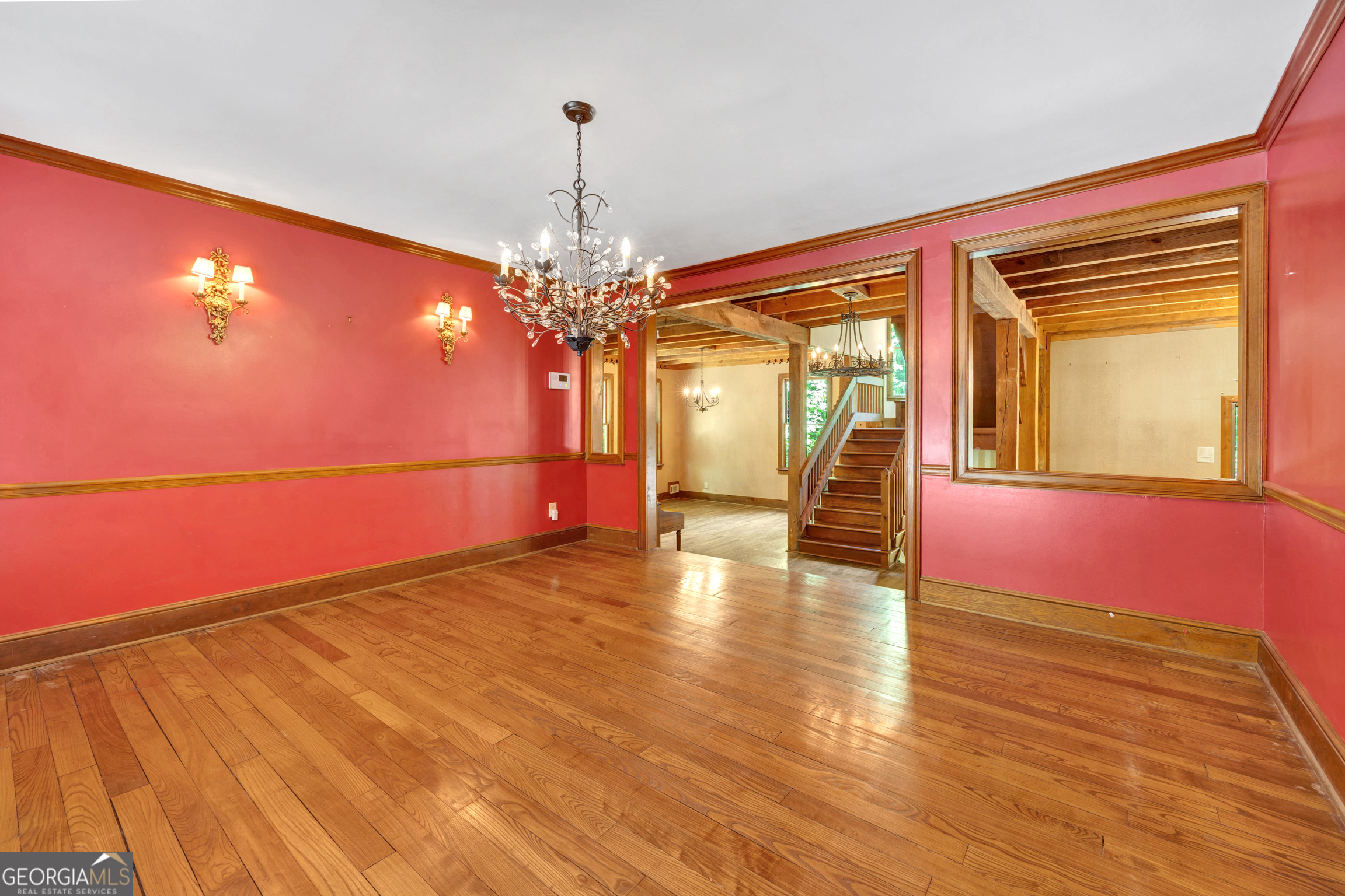 400 River Cove Road Social Circle, GA 30025 - Photo 21 of 83 a view of a room with wooden floor chandelier and windows