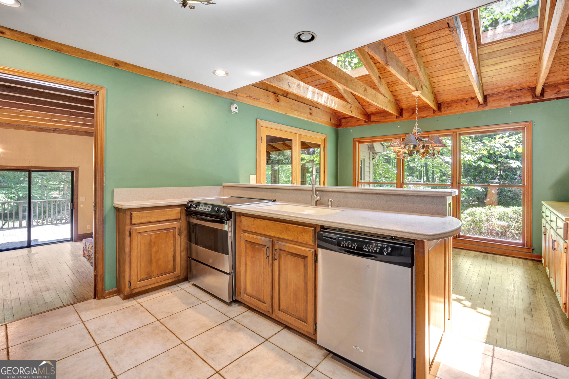 400 River Cove Road Social Circle, GA 30025 - Photo 25 of 83 a kitchen with a stove a sink and a refrigerator
