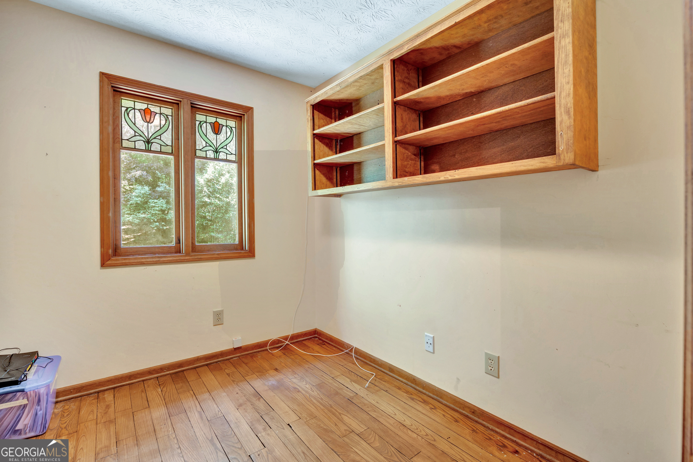 400 River Cove Road Social Circle, GA 30025 - Photo 32 of 83 a view of empty room with wooden floor and fan