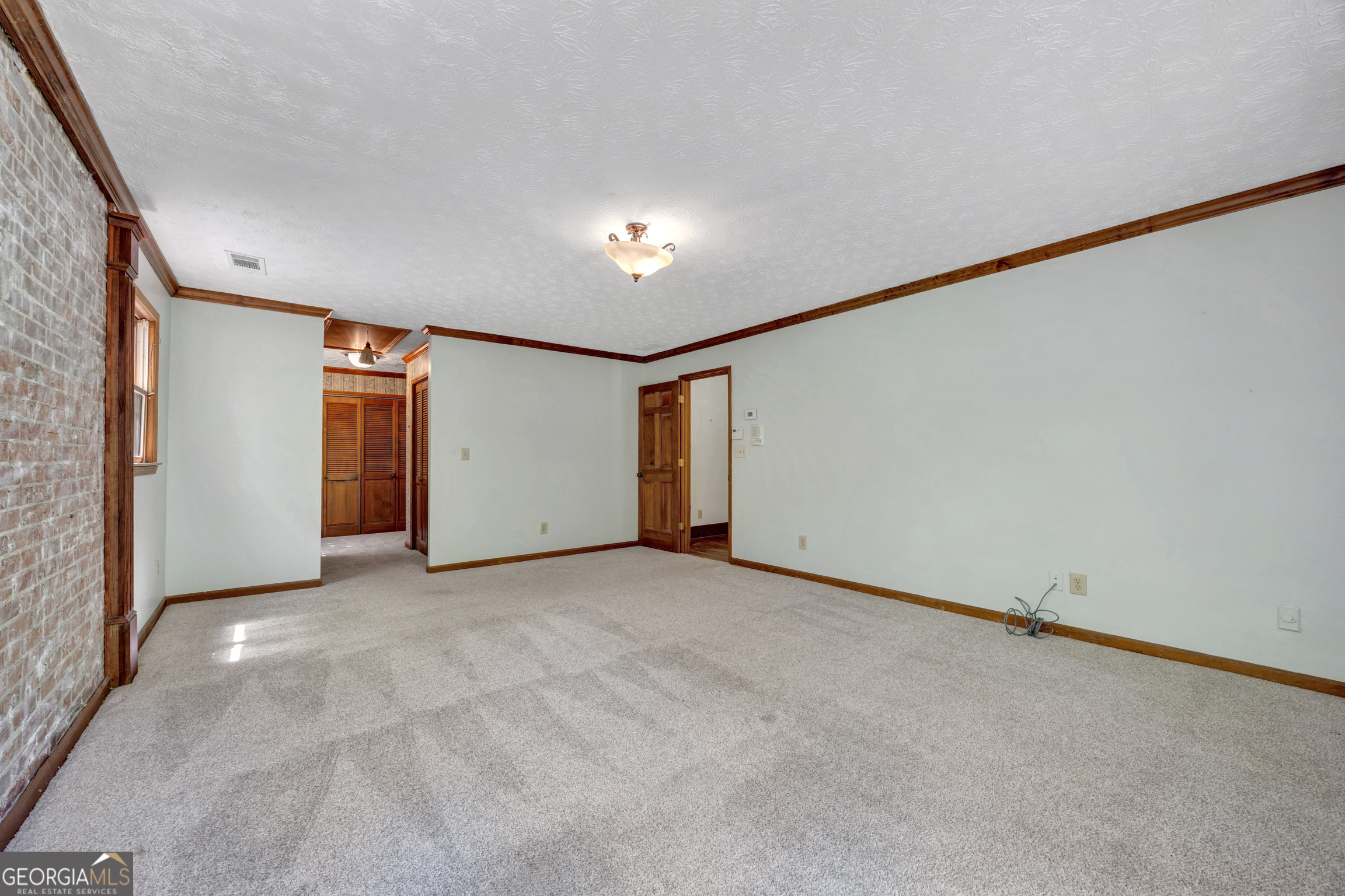 400 River Cove Road Social Circle, GA 30025 - Photo 39 of 83 an empty room with closet and windows