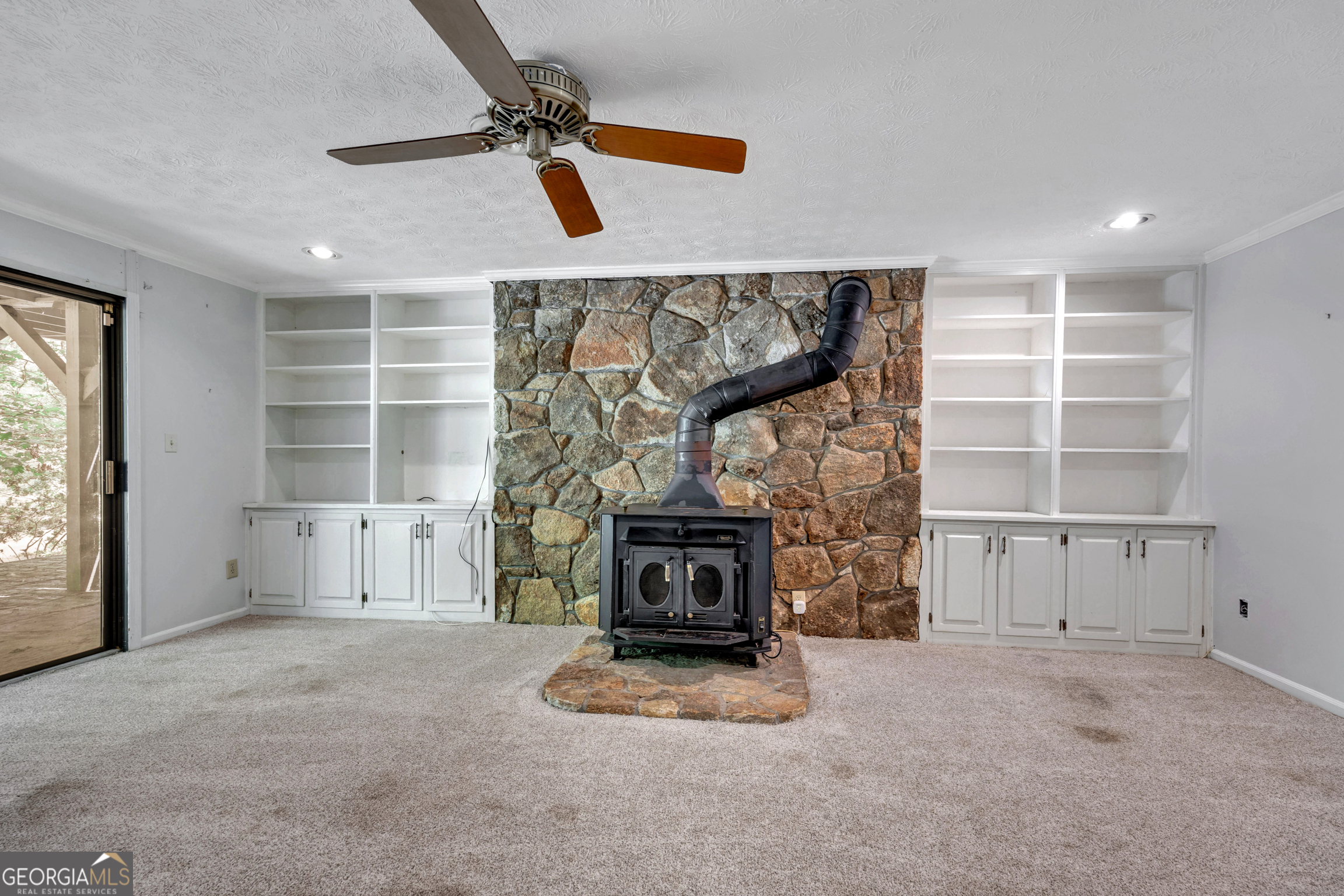 400 River Cove Road Social Circle, GA 30025 - Photo 53 of 83 a view of empty room with a fireplace and window