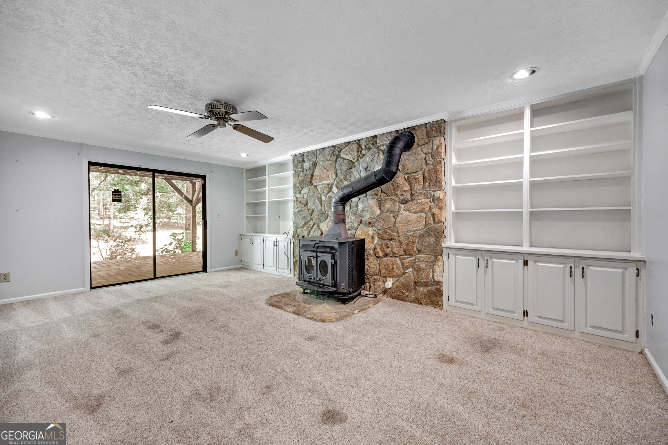 400 River Cove Road Social Circle, GA 30025 - Photo 54 of 83 a view of an empty room with a fireplace and windows