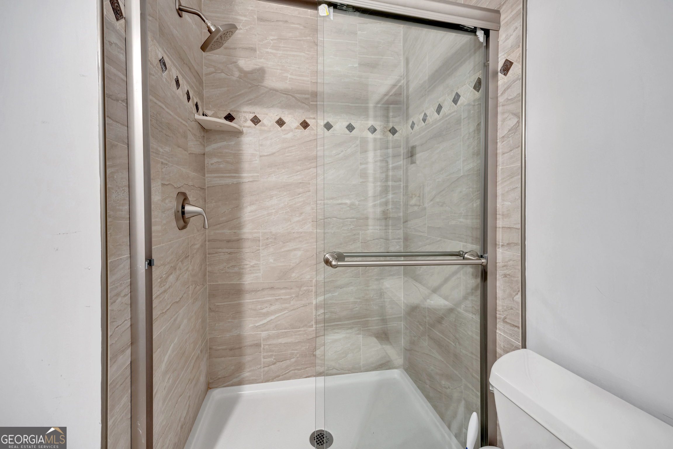 400 River Cove Road Social Circle, GA 30025 - Photo 59 of 83 a bathroom with a shower and toilet