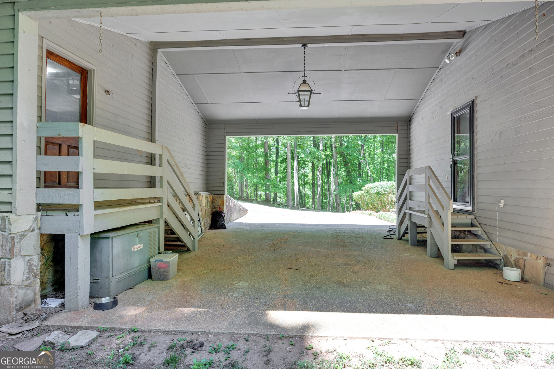 400 River Cove Road Social Circle, GA 30025 - Photo 63 of 83 a view of a livingroom with furniture and staircase