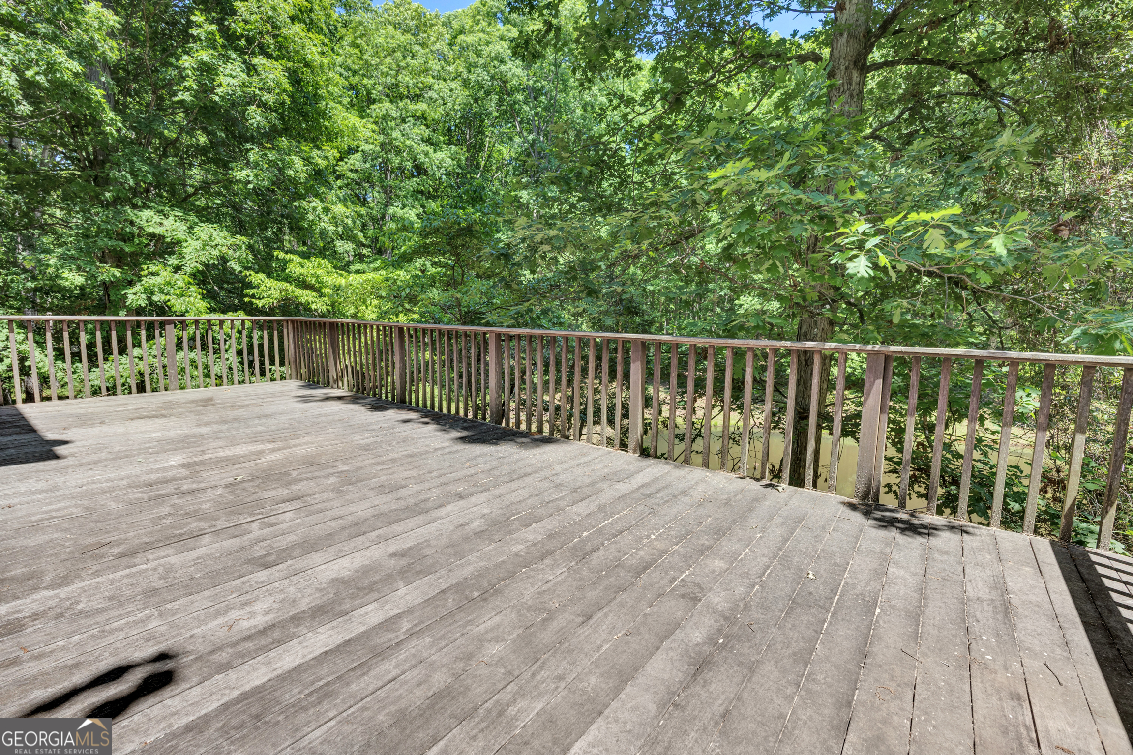 400 River Cove Road Social Circle, GA 30025 - Photo 64 of 83 a view of balcony with wooden floor and fence