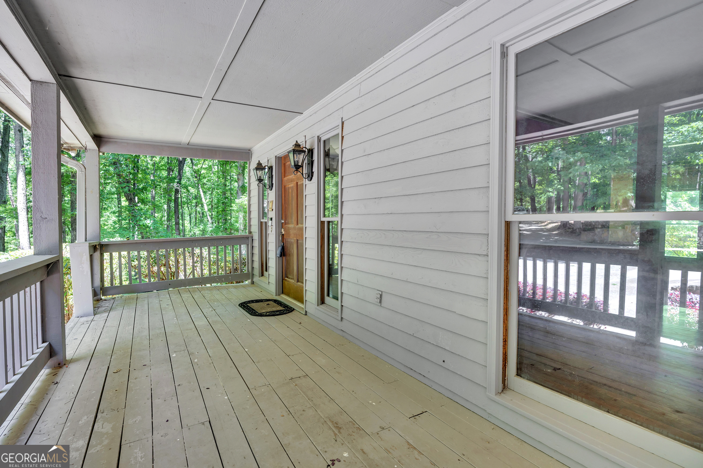 400 River Cove Road Social Circle, GA 30025 - Photo 9 of 83 a view of a balcony with wooden floor