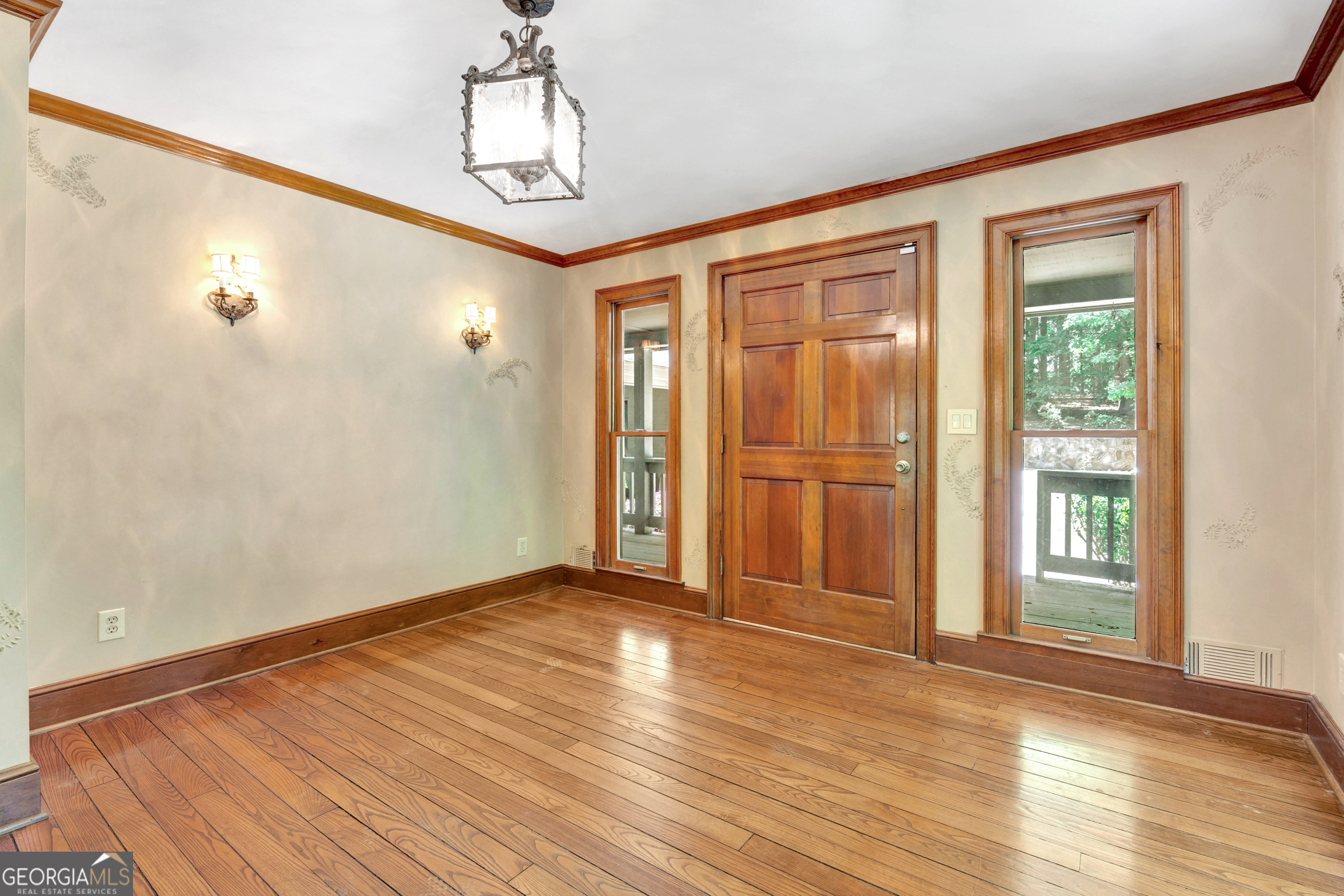 400 River Cove Road Social Circle, GA 30025 - Photo 10 of 83 a view of an empty room with wooden floor and a window