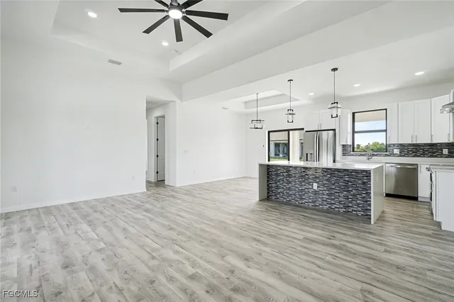 a living room with kitchen furniture and a kitchen view