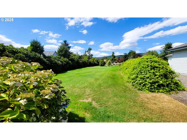 a view of a house with a backyard porch and sitting area