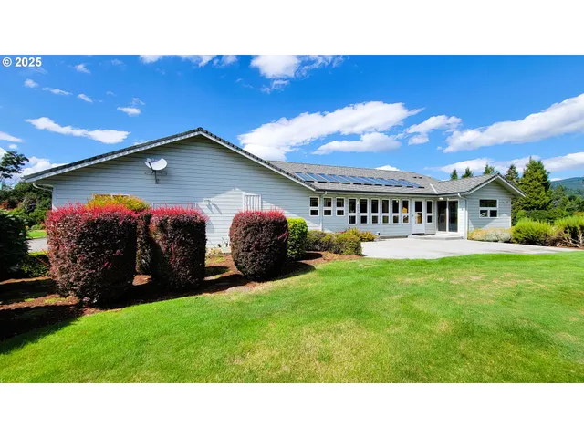 a black and white photo of a house