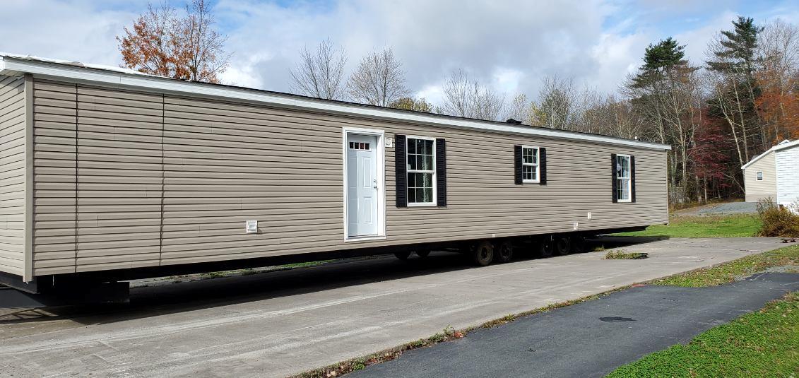 394 State Rt 17B Monticello, NY 12701 - Photo 2 of 6 a side view of a house with a large window