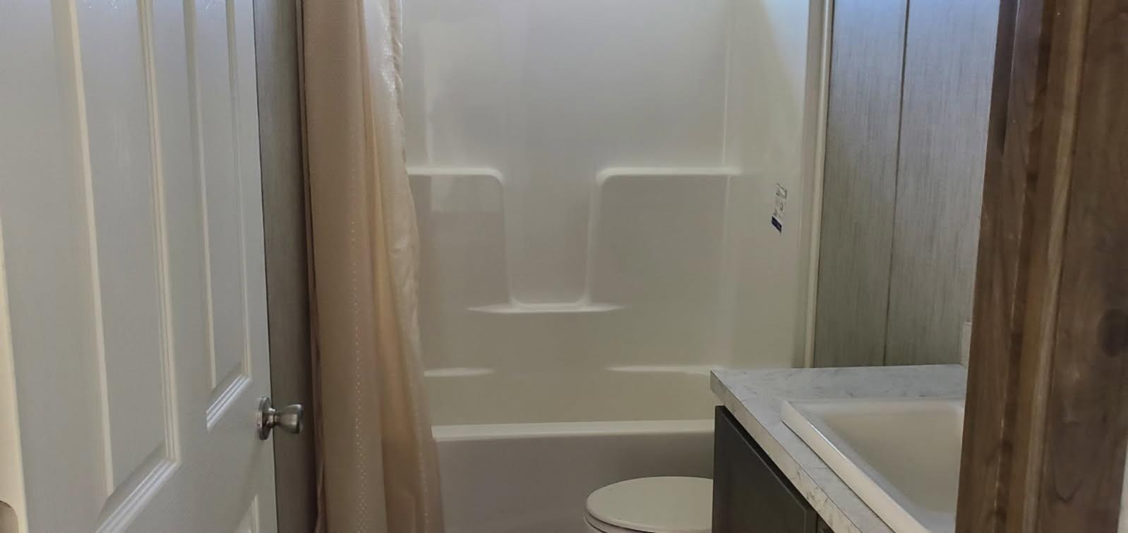 394 State Rt 17B Monticello, NY 12701 - Photo 4 of 6 a bathroom with a sink and toilet