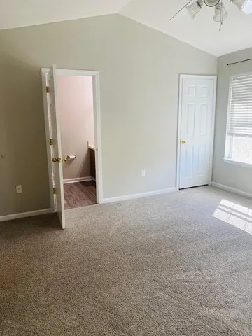 a view of empty room with windows