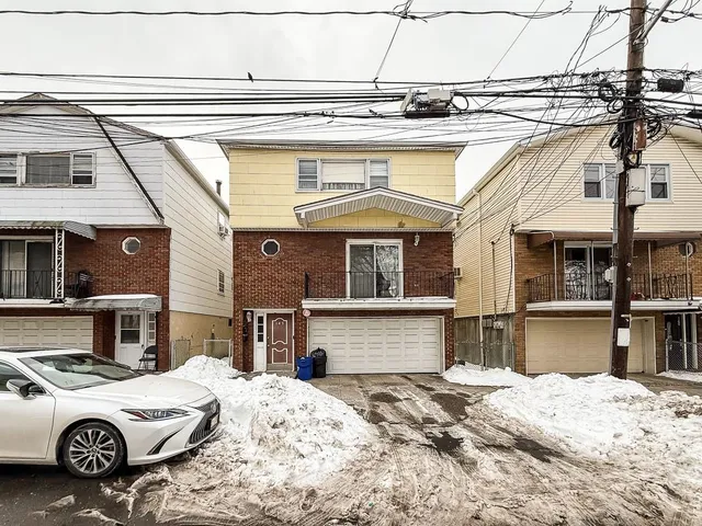 a front view of a house with parking
