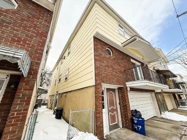 a view of a house with a street