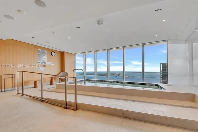 a view of an empty room with windows