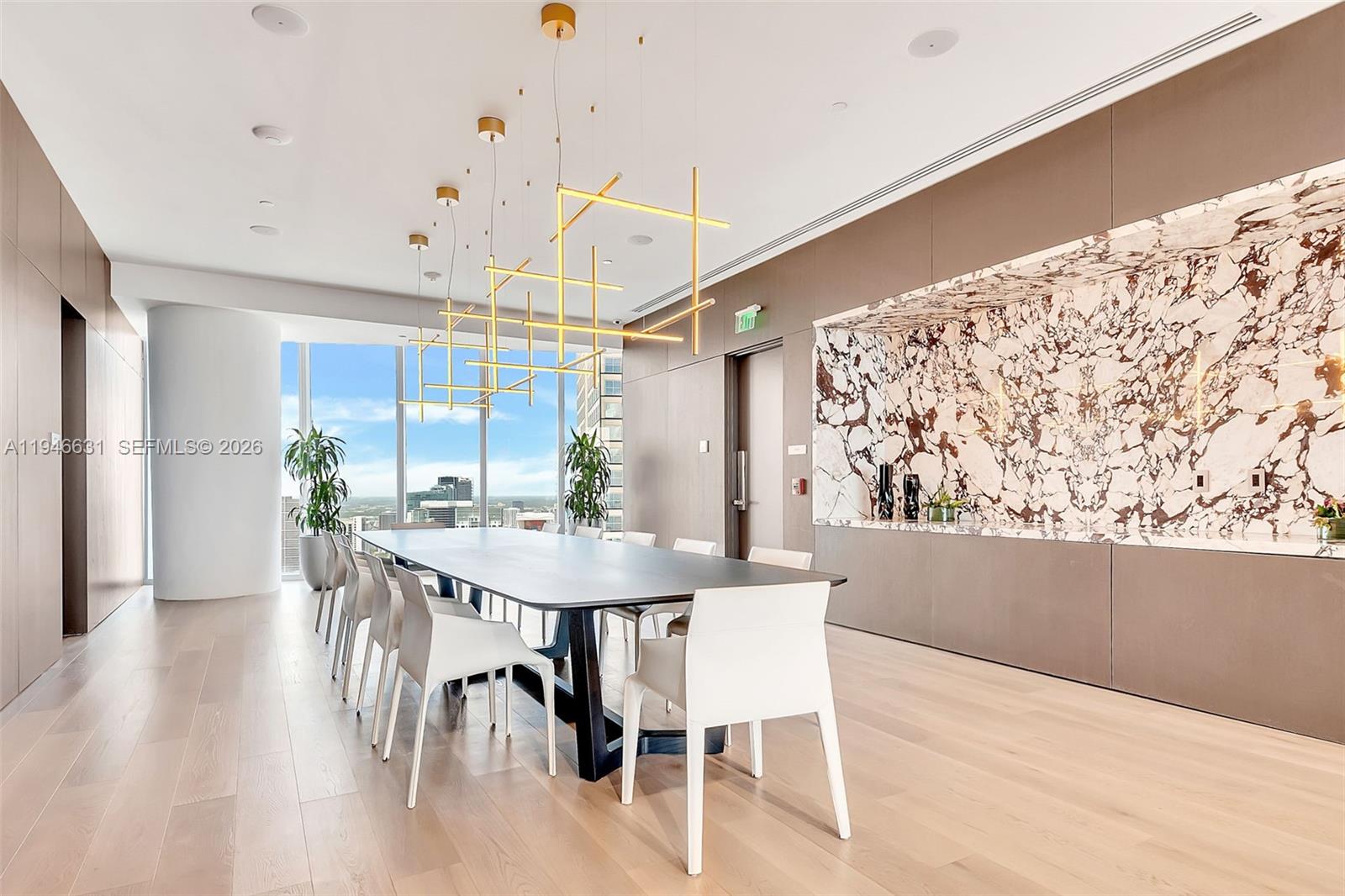 300 Biscayne Blvd Way, Unit 2808 Miami, FL 33131 - Photo 27 of 33 a view of a dining room with furniture and wooden floor