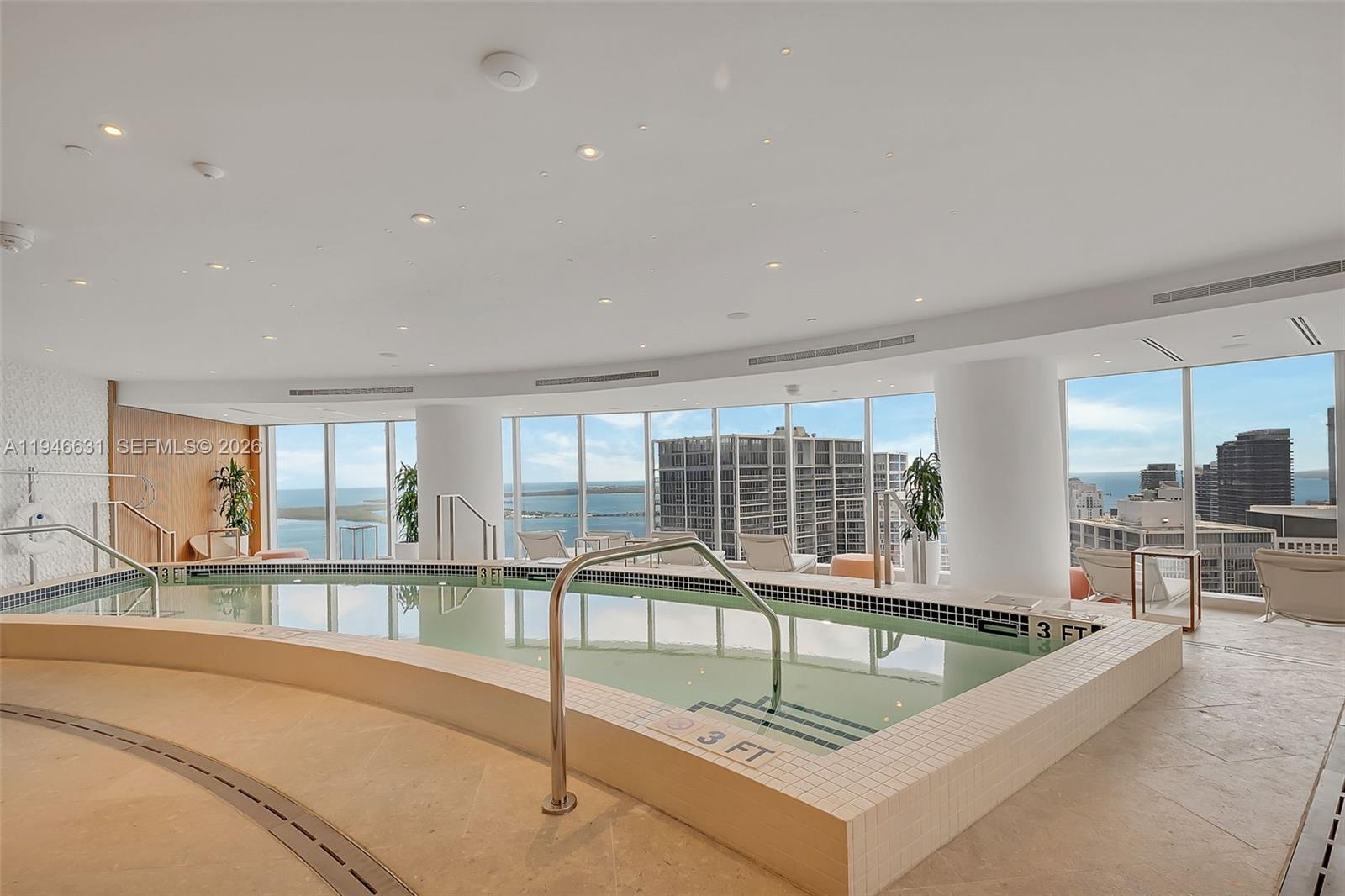 300 Biscayne Blvd Way, Unit 2808 Miami, FL 33131 - Photo 10 of 33 a view of a living room and a large window