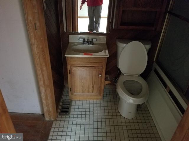 442 Old Home Road Baltimore, MD 21206 - Photo 5 of 12 a bathroom with a toilet a sink and a window