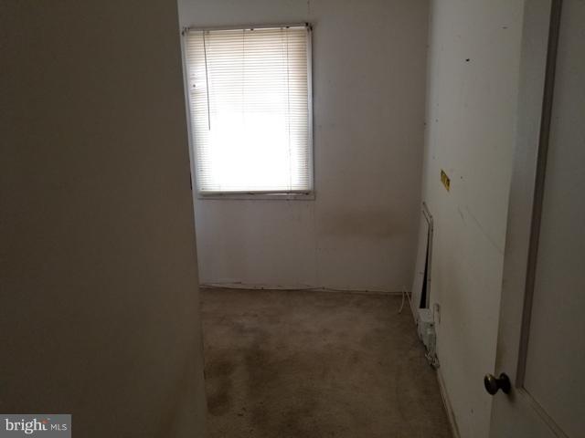 442 Old Home Road Baltimore, MD 21206 - Photo 6 of 12 a view of an empty room with a window