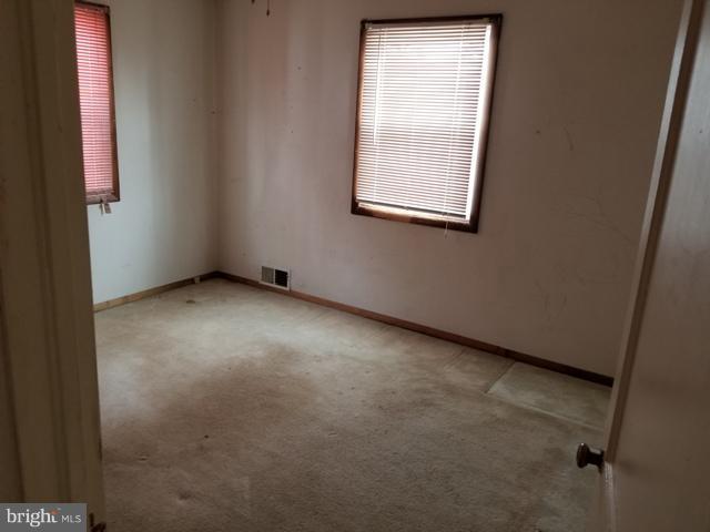 442 Old Home Road Baltimore, MD 21206 - Photo 7 of 12 an empty room with windows