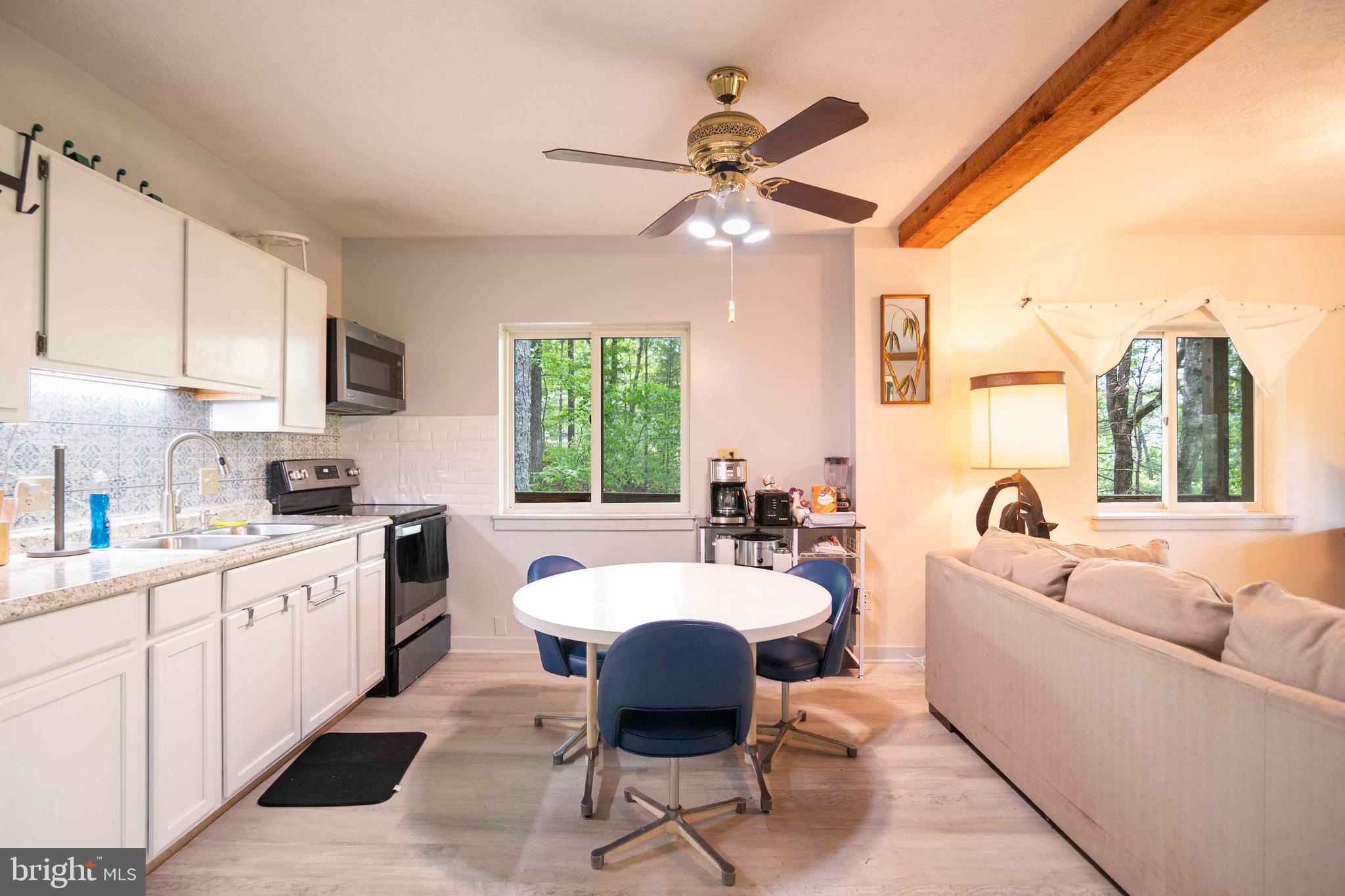 272 Fritzel Way Mount Jackson, VA 22842 - Photo 26 of 60 a large kitchen with a table chairs and a kitchen view