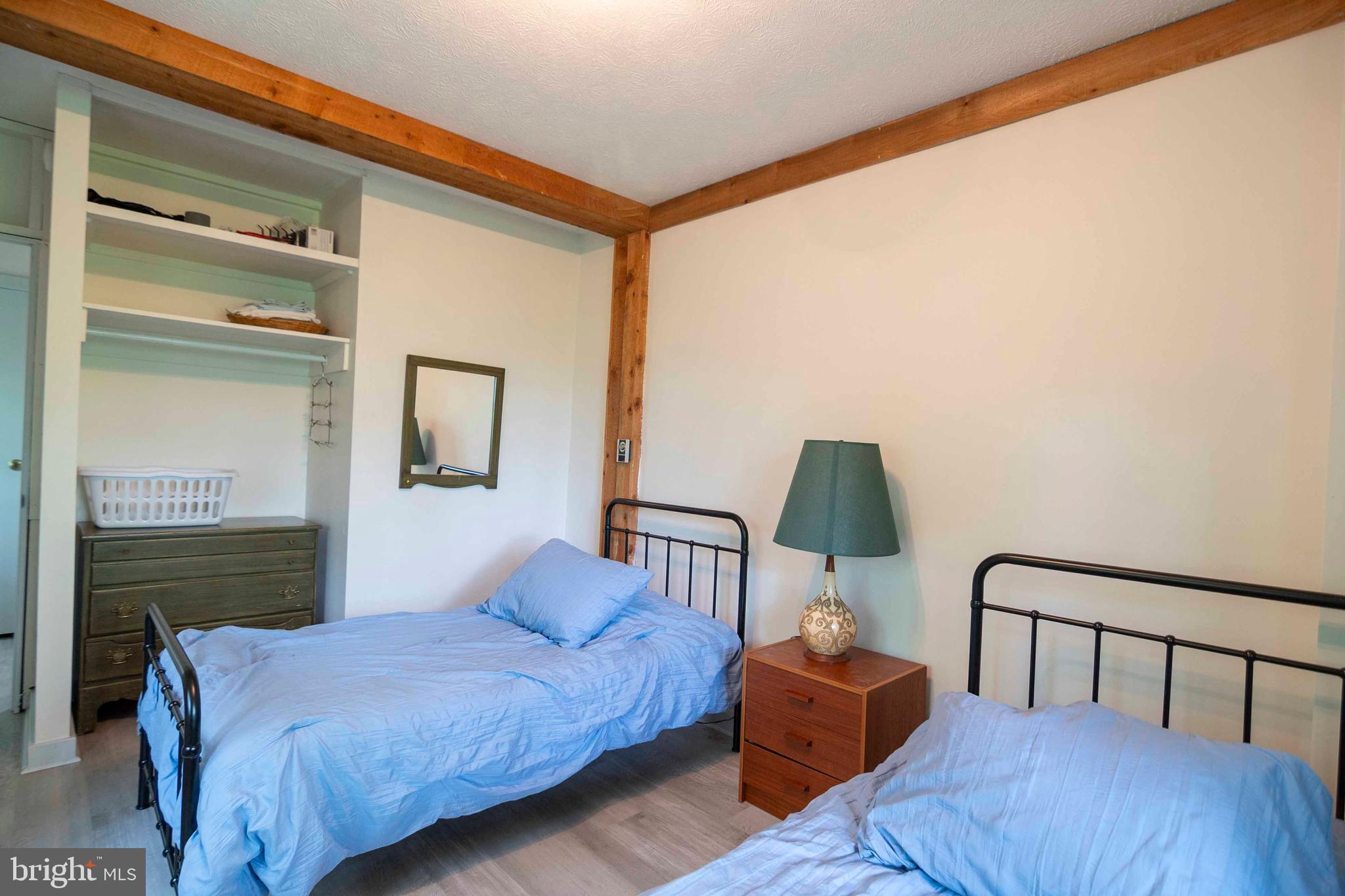 272 Fritzel Way Mount Jackson, VA 22842 - Photo 30 of 60 a bedroom with a bed and wooden floor