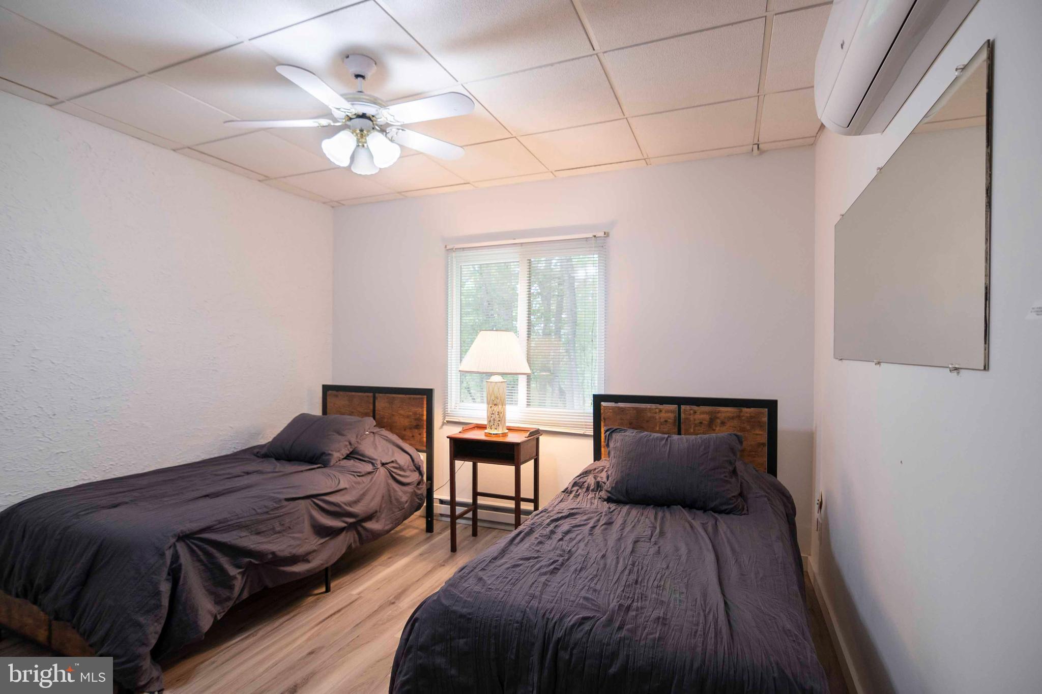 272 Fritzel Way Mount Jackson, VA 22842 - Photo 44 of 60 a bedroom with a bed and a chandelier