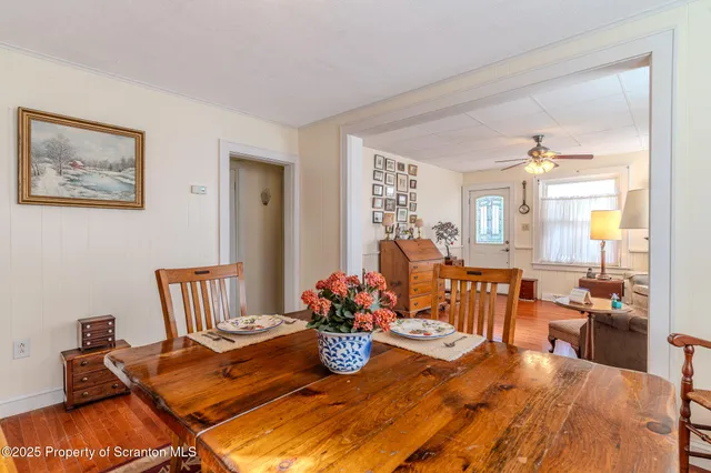 a living room with furniture fireplace and a large window