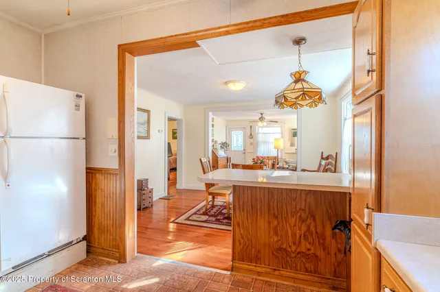 a view of a kitchen with furniture and a window