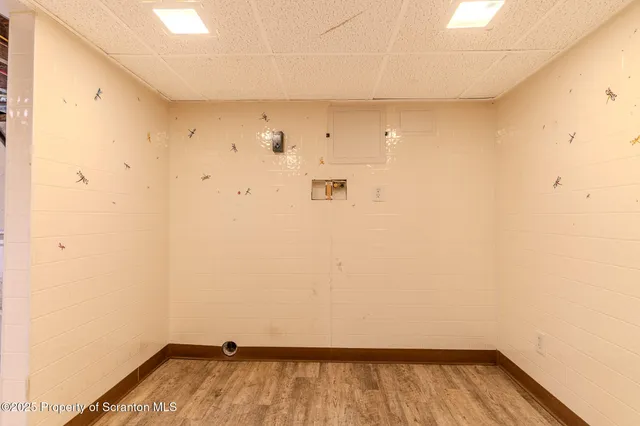 a view of a room with wooden floor