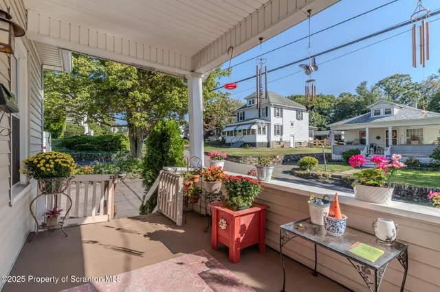 a view of a house with a yard and stairs