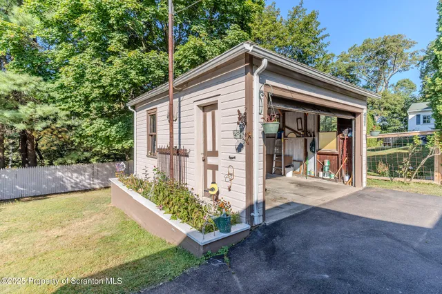 a view of a house with backyard and balcony