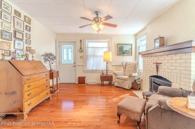 a bedroom with furniture and a large window