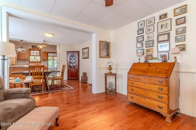 a bedroom with furniture and wooden floor