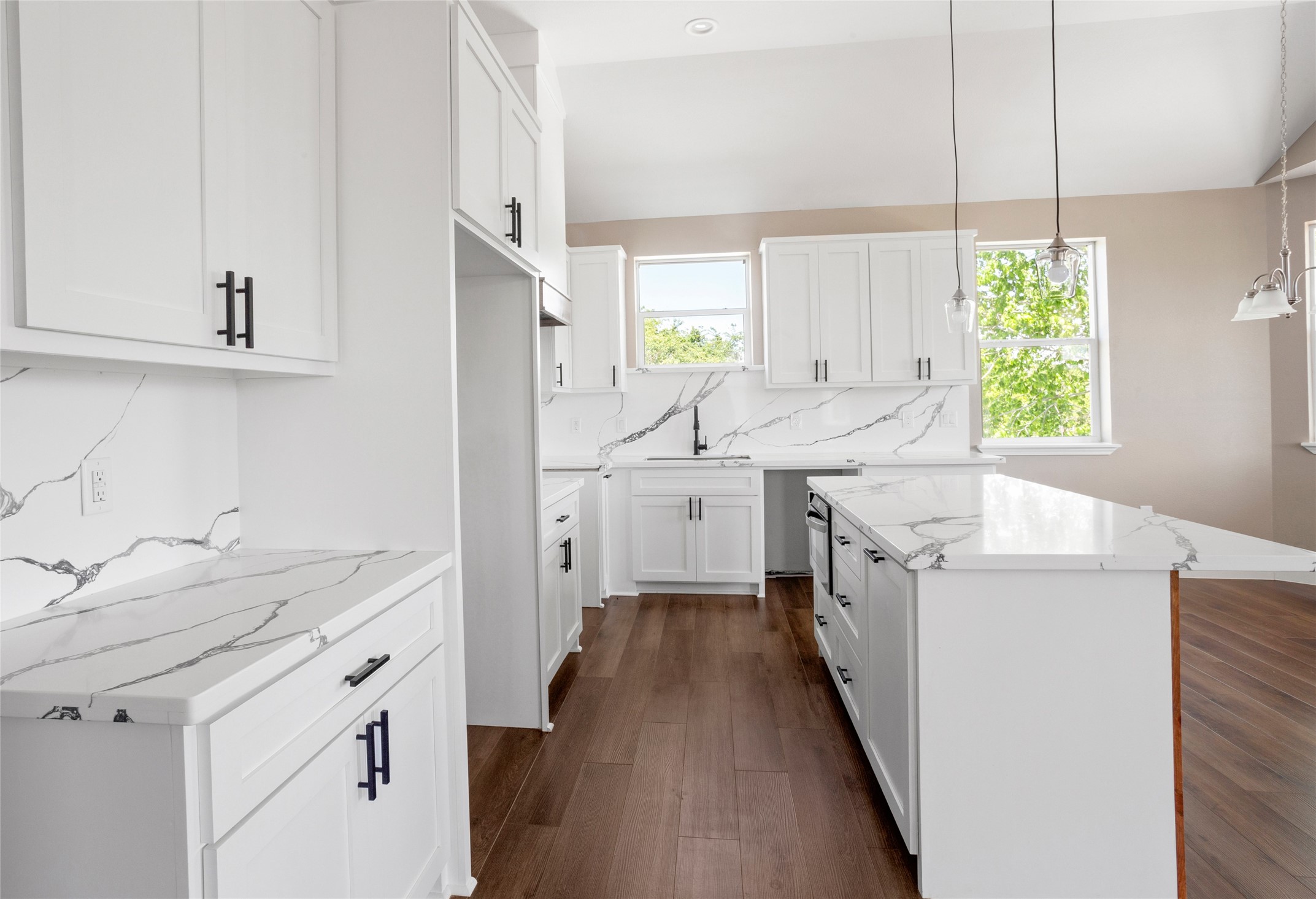 1226 9th Street San Leon, TX 77539 - Photo 11 of 32 a kitchen with a sink stove and cabinets
