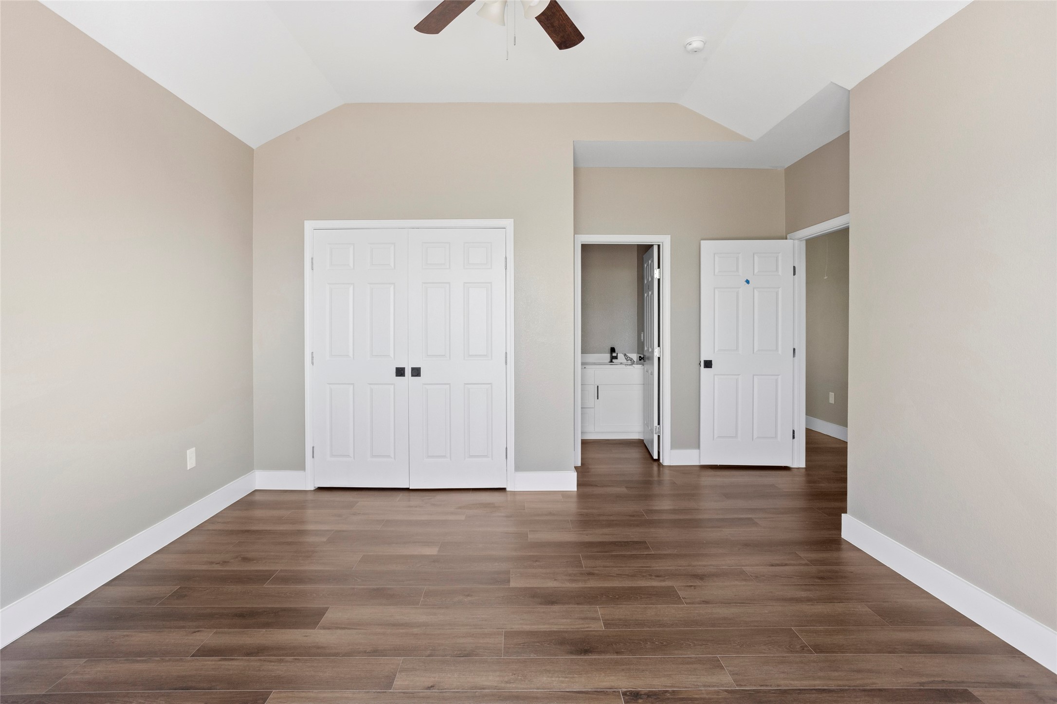 1226 9th Street San Leon, TX 77539 - Photo 17 of 32 a view of an empty room with wooden floor