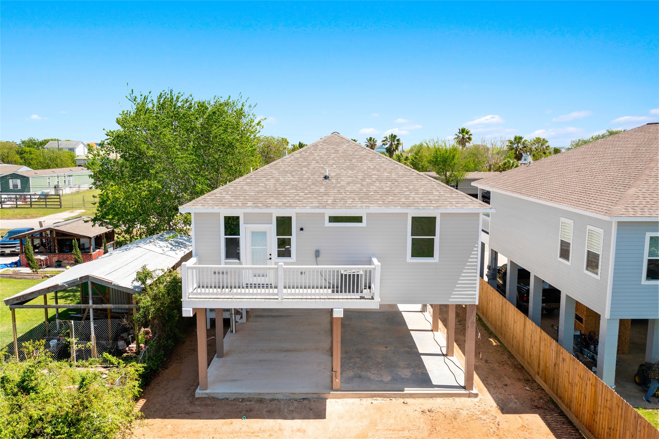 1226 9th Street San Leon, TX 77539 - Photo 28 of 32 a view of house with backyard outdoor seating and entertaining space