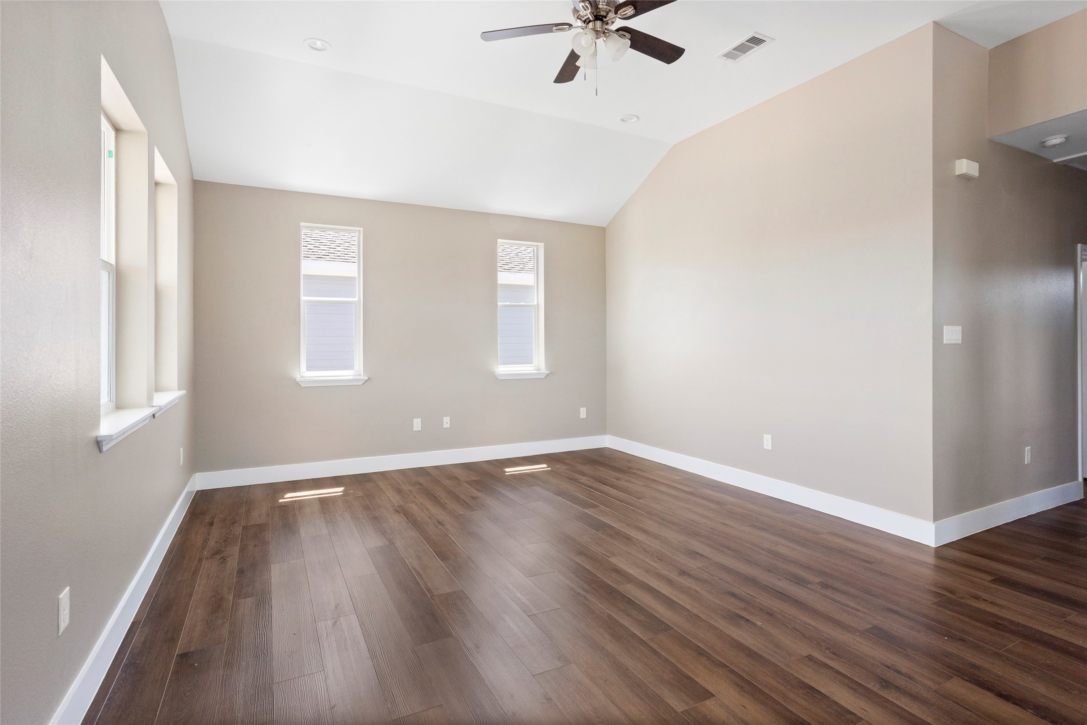 1226 9th Street San Leon, TX 77539 - Photo 8 of 32 an empty room with wooden floor and windows